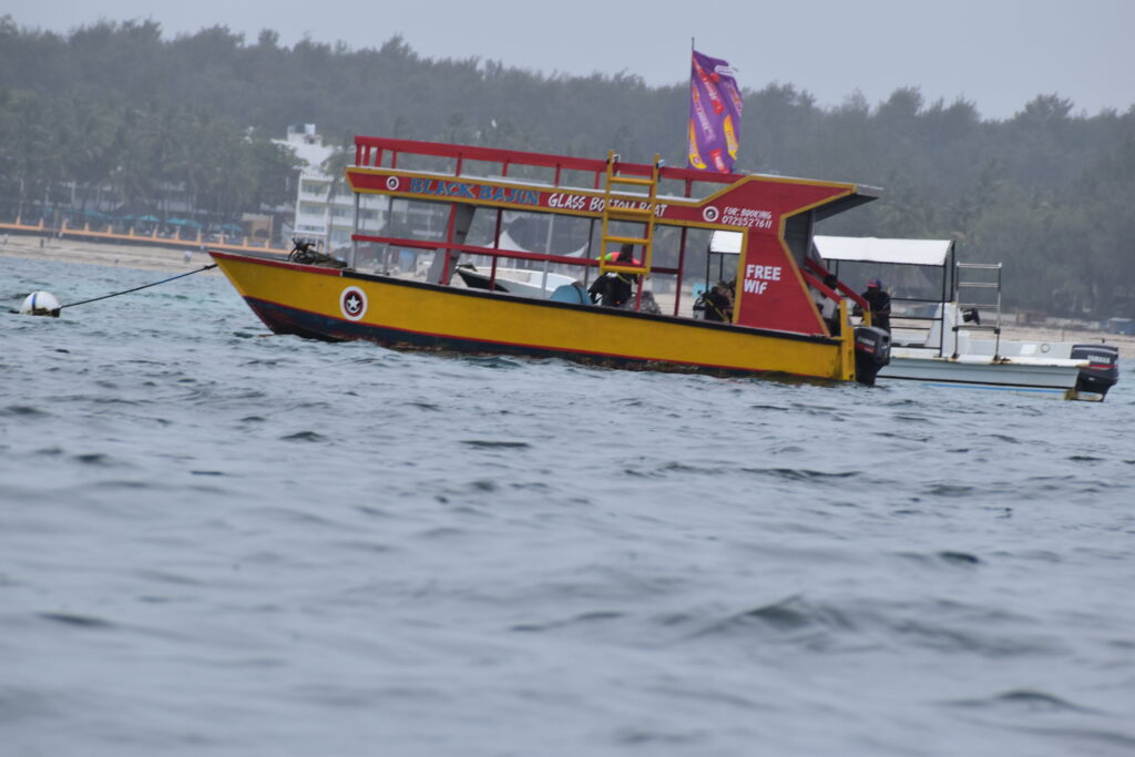 A BOAT DOCKED AT MOMBASA MARINE NATIONAL PARK & RESERVE